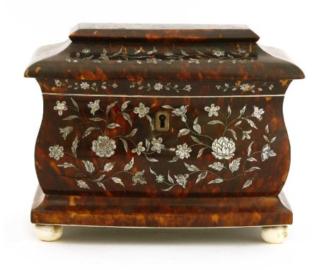 A George III tortoiseshell tea caddy, the front and lid inlaid with mother-of-pearl, with two interior divisions, on ivory bu