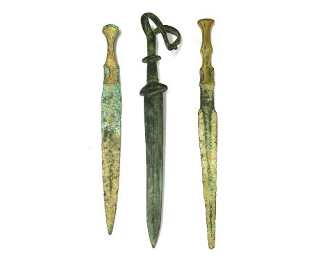 Antiquities: three bronze daggers, two labelled 'Luristan 800-1200 BC', largest 41cm long (3)