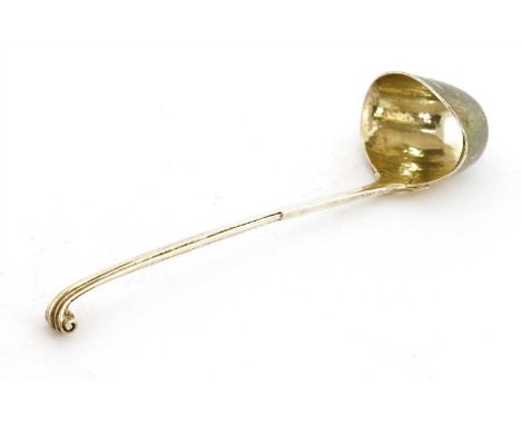 A silver ladle, Omar Ramsden, London, 1915, with a scroll handle and beaten bowl, 17cm long, 1.5ozt