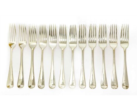 A set of twelve Victorian silver old English pattern table forks , by George Adams, London, 1874, each engraved with the cres