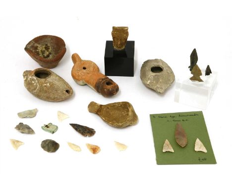Antiquities, to include: two clay lamps, a terracotta head and a flint arrow head, etc. (qty.)