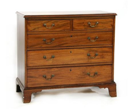 A George III mahogany chest, the rectangular moulded crossbanded top over two short and three long graduated drawers, and bra