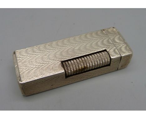 A Dunhill silver cigarette lighter, 89g 