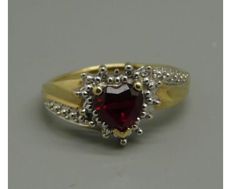 A 9ct gold heart shaped red stone and diamond ring, 2.3g, size M 