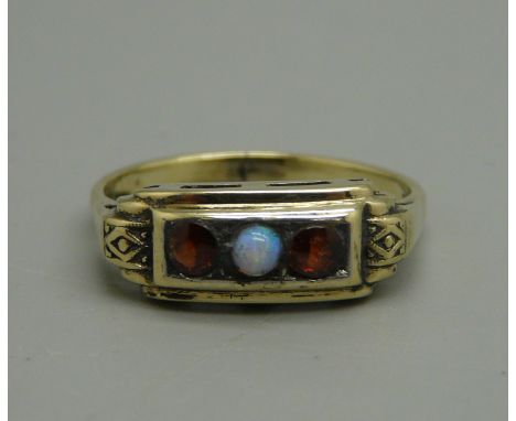 A 9ct gold, garnet and opal ring, stamped 9k, 2.6g, size O/P 