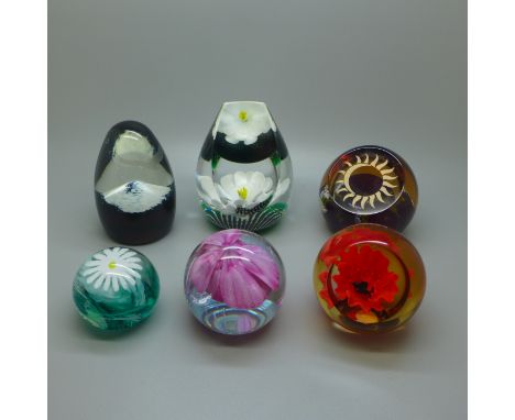 Six Caithness glass paperweights, boxed 