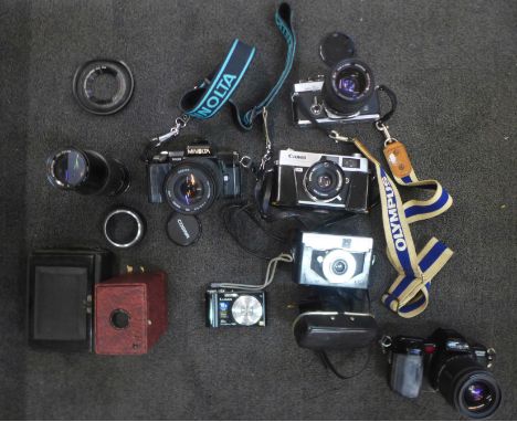 A collection of 35mm film cameras including Olympus, Canon and Minolta, lenses and camera bags 