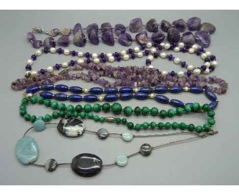 A large amethyst necklace, a lapis lazuli necklace, malachite and silver mounted gem necklaces, etc. 