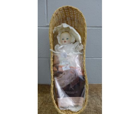 A Royal Doulton 'First Born' doll 1982, original clothes and basket 
