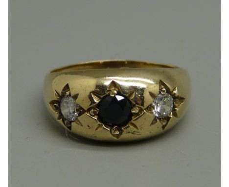 A 9ct gold, garnet and white stone gypsy ring, 4.4g, size R/S 