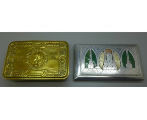 A WWI Christmas tin containing a Bible, a cigarette lighter and cigarette case 