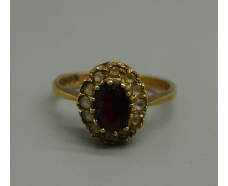 A 9ct gold and garnet ring, 2.4g, size M/N 