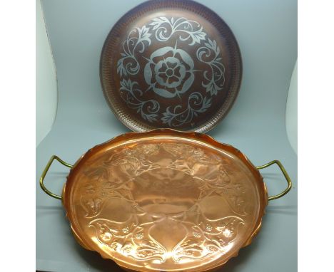 An Art Nouveau copper tray and one other with HV monogram and signed by Brian Wallis 