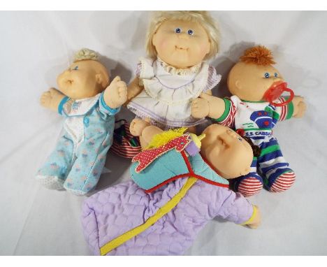 Four Cabbage Patch dolls