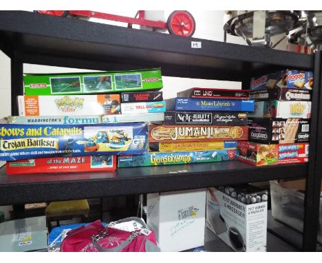 A collection of approx 18 board games to include Subbuteo, Waddingtons Formula One, Crossbows and Catapults, Jumanji, Screwba
