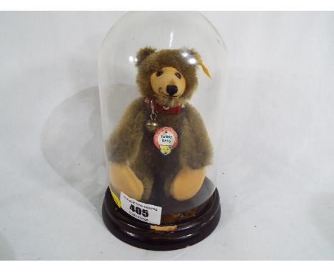 Steiff - a good quality Historic Steiff miniature bear with button and label to ear No.029721 in glass dome display case, 17c
