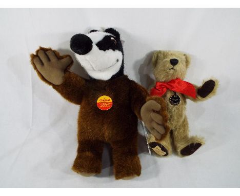 A Steiff Badger, Börse Dachs, button in ear with white tag label and certificate, 32 cm (high) and a Dean's Bear entitled 'So