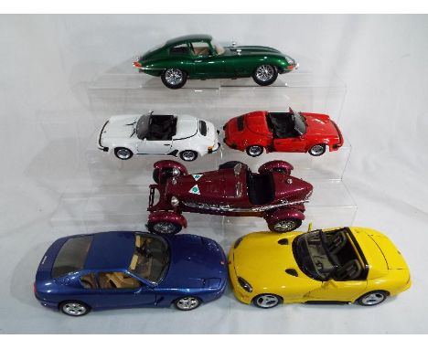 A collection of four Burago diecast model motor vehicles 1/18 scale to include a Ferrari 456 GT,  a Viper Dodge RT/10, E type