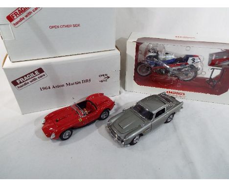 Danbury Mint - two diecast 1:24 scale models depicting a James Bond 007 Aston Martin DB5 replica of the car driven by James B