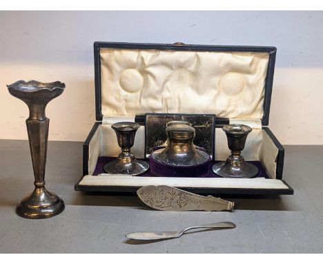 Mixed silver to include a cased set of, weighted, silver ink pot and pair of candlesticks, a weighted candlestick and two kni