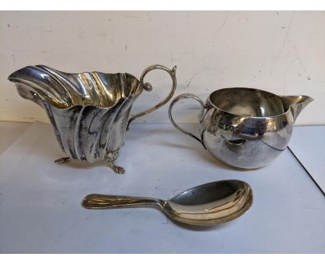Mixed silver to include two cream jugs together with a caddy spoon, 139.1gLocation: 