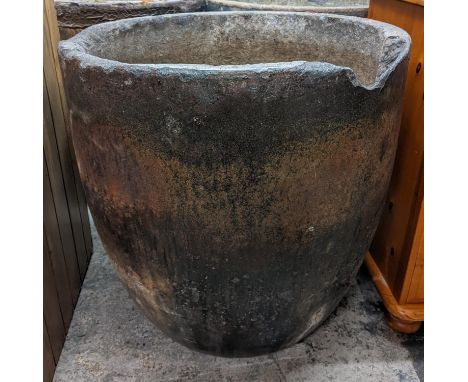 A large foundry glazed smelting pot used as a garden planter 63cm h x 62cm w Location: 