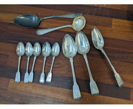 Three George III silver tablespoons and five Victorian silver teaspoons 274g, and French silver comprising a tablespoon and a