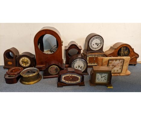 A collection of clocks and clock parts to include an oak mantel clock striking on five rods, a large Edwardian clock case, a 