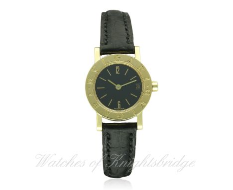 A LADIES 18K SOLID GOLD BULGARI WRIST WATCH CIRCA 1990, REF. BB 23 GLD D: Black dial with gilt batons &amp; Arabic numerals, 