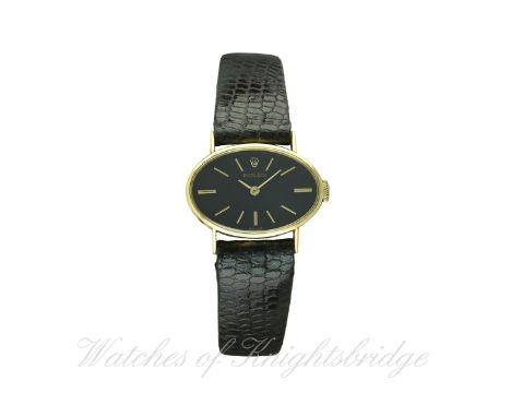 A LADIES 18K SOLID GOLD ROLEX WRIST WATCH CIRCA 1970s
D: Black dial with gilt batons. M: 18 jewel manual wind movement, signe