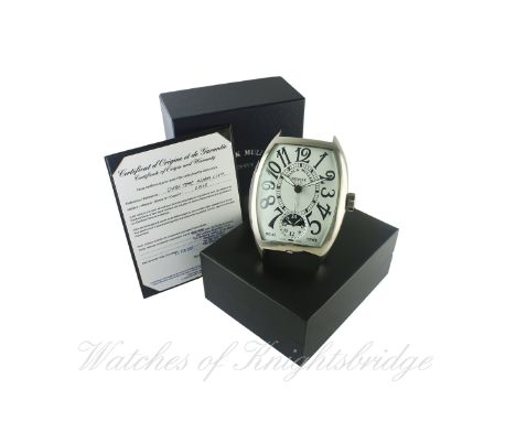 A FRANCK MULLER DUAL TIME ALARM DESK CLOCK DATED 2007 WITH ORIGINAL BOX & PAPERS
D: Silver dial with Arabic numerals, inner m