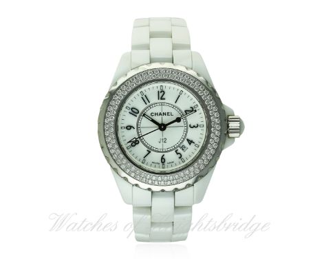 A LADIES MID SIZE WHITE CERAMIC & DIAMOND CHANEL J12 BRACELET WATCH DATED 2007, WITH BOX & PAPERS
D: White dial with raised A