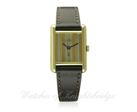 A LADIES SILVER GILT MUST DE CARTIER WRIST WATCH CIRCA 1990s D: Three coloured gilt dial. M: Manual wind movement signed Cart