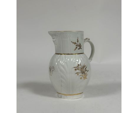 A Caughley porcelain mask jug, c. 1790, of characteristic form, with leaf-moulded body, decorated with gilt floral sprigs and