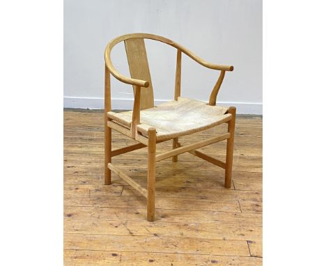 Hans J. Wegner for PP Mobler, A PP66 'Chinese' chair, bent and turned ash, the sweeping crest rail and arm rests over plain s