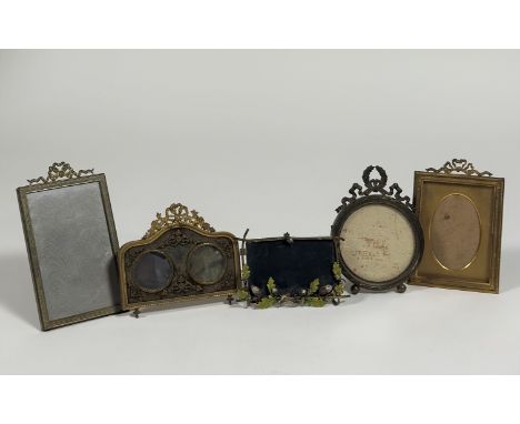 A group of small Edwardian gilt-metal photograph frames comprising: a double aperture frame, the twin circular apertures with