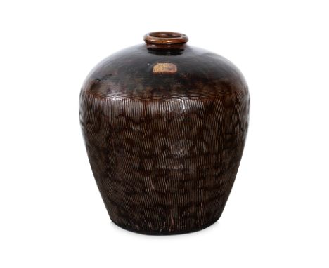 A VERY LARGE CHINESE POTTERY JAR
Circa Early/Mid 20th Century, brown glazed jar with rounded sides, narrow rounded mouth rim,