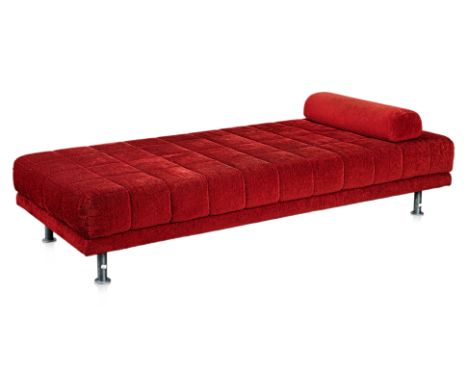 AN UPHOLSTERED DAYBED
Red toweling fabric upholstery, foam mattress, supported by a steel frame with tubular steel legs
210cm