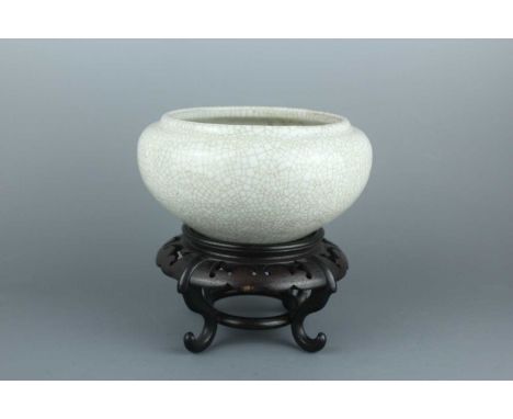 A Chinese ge-type bowl or incense burner, Qing Dynasty 19th century, the compressed globular body raising to a short and slig