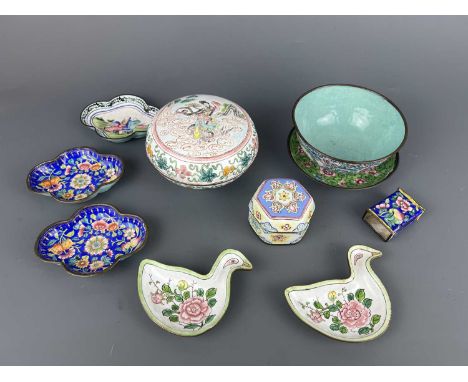 A group of nine painted enamel pieces, 19th/20th century, comprising a figural circular box with cover, a flower bowl with a 