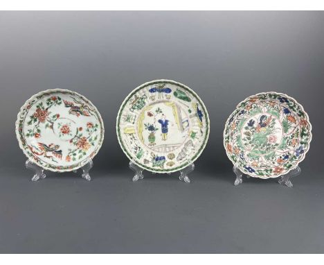 Three Chinese famille verte saucer dishes, Qing Dynasty Kangxi period (1662-1722). The right dish with phoenixes flying among