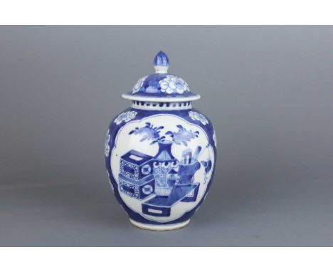 A Chinese blue and white “Hundred Antiques” ovoid jar with cover, Qing Dynasty late 19th century, painted with scholar’s prev