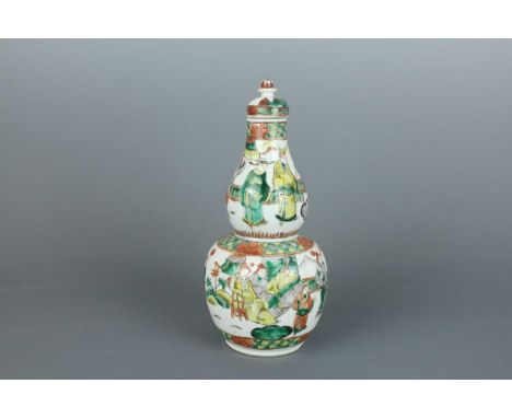 A Chinese famille verte double-gourd “figural” vase with original cover, late 19th century, lively painted in polychrome enam