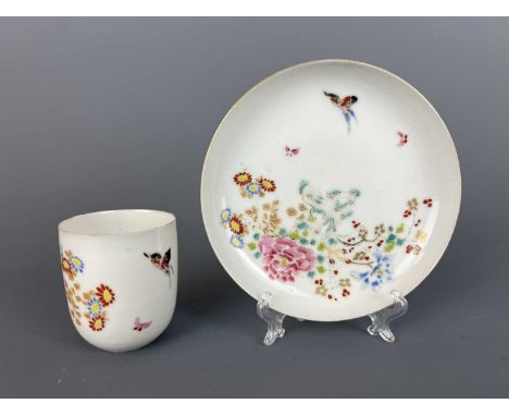 A Japanese egg-shell enamel painted cup and saucer, Meiji period (1869-1912), delicately painted with butterflies among flowe