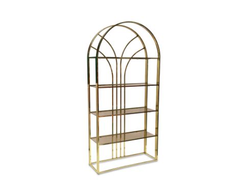 AN ETAGERES BOOKCASE, the art deco style shelf unit with five tinted glass shelves to a brass finish, 72" high x 35" wide x 1