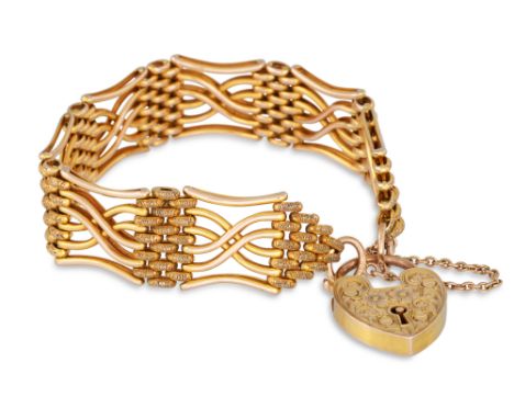 A 9CT GOLD GATE BRACELET, with padlock, engraved decoration, 23 g.