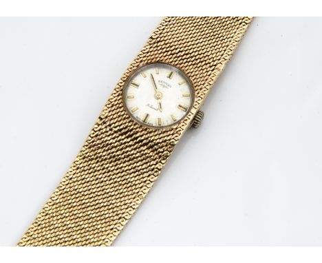 A c1970s 9ct gold Rotary lady~s wristwatch, circular dial in an integrated mesh link 9ct gold bracelet, 38.6g