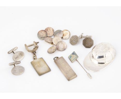A modern silver jockey cap tea caddy spoon, together with a pair of silver MG cufflinks, an Allied Dunbar silver pair of cuff