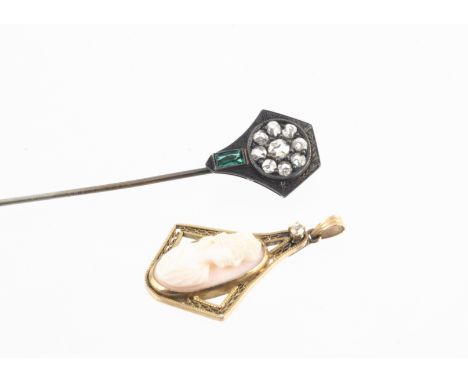 An Edwardian gem set silver stick pin, the rough cut white stones within an engraved hexagonal mount and a scissor cut green 