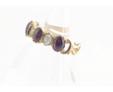 An early 19th Century ruby and pearl ring, the three cabochon rubies in rubbed over settings alternately set with oval bliste